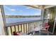Lakefront balcony with seating for two, enjoying scenic views at 1065 S Hiawassee Rd # 1428, Orlando, FL 32835