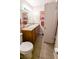 Double sink bathroom with wood cabinets and tile floor at 1065 S Hiawassee Rd # 1428, Orlando, FL 32835