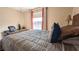 Comfortable bedroom with a bed, desk and lake view at 1065 S Hiawassee Rd # 1428, Orlando, FL 32835