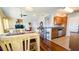 Open kitchen with granite countertop and dining area at 1065 S Hiawassee Rd # 1428, Orlando, FL 32835