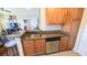 Kitchen with granite countertops, stainless steel appliances, and breakfast bar at 1065 S Hiawassee Rd # 1428, Orlando, FL 32835