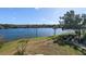 Scenic view of a lake with lush green landscape and residential buildings in the background at 1065 S Hiawassee Rd # 1428, Orlando, FL 32835