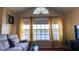 Living room features lake view, hardwood floors and comfortable seating at 1065 S Hiawassee Rd # 1428, Orlando, FL 32835