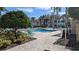 Community pool area with lounge chairs at 1065 S Hiawassee Rd # 1428, Orlando, FL 32835