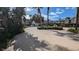 Community pool with lounge chairs surrounded by tropical landscaping at 1065 S Hiawassee Rd # 1428, Orlando, FL 32835