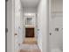 Hallway with doors to bedrooms and a bathroom at 1209 Limbali St, Mount Dora, FL 32757