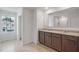 Double vanity bathroom with granite countertop at 1209 Limbali St, Mount Dora, FL 32757