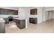 Open concept kitchen with island and stainless steel appliances at 1209 Limbali St, Mount Dora, FL 32757