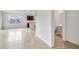 Living room with tile floors and half bathroom access at 1209 Limbali St, Mount Dora, FL 32757