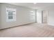 Spacious bedroom with two windows and neutral decor at 1209 Limbali St, Mount Dora, FL 32757