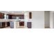 Kitchen with dark brown cabinets and stainless steel appliances at 1209 Limbali St, Mount Dora, FL 32757