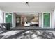 Covered patio with sliding glass doors opening to the living room at 1429 Chapman Cir, Winter Park, FL 32789