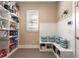 Well-organized pantry with built-in shelving and a comfortable window seat at 1429 Chapman Cir, Winter Park, FL 32789