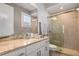 Modern bathroom with granite countertop, glass shower, and updated fixtures at 1429 Chapman Cir, Winter Park, FL 32789