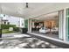 Covered patio with sliding glass doors opening to the living room at 1429 Chapman Cir, Winter Park, FL 32789