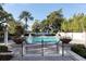 Resort-style pool with lush landscaping and lake views at 1429 Chapman Cir, Winter Park, FL 32789