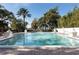 Sparkling community pool with lake view and gazebo at 1429 Chapman Cir, Winter Park, FL 32789