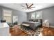 Spacious bedroom with hardwood floors, large windows and ceiling fan at 1429 Chapman Cir, Winter Park, FL 32789