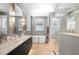 Elegant bathroom with a freestanding tub, double vanity, and glass shower at 1429 Chapman Cir, Winter Park, FL 32789