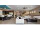 Open living area features stylish white couches, a dark wood coffee table, and a view into the kitchen at 1429 Chapman Cir, Winter Park, FL 32789