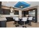 Modern kitchen with dark cabinetry, stainless steel appliances, and a granite island at 1429 Chapman Cir, Winter Park, FL 32789