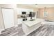 Open concept kitchen with white cabinets, granite countertops, and stainless steel appliances at 2642 Magnolia Cir, Lake Wales, FL 33898