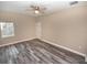 Bedroom with ceiling fan, closet, and wood-look flooring at 2642 Magnolia Cir, Lake Wales, FL 33898