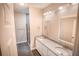 Double vanity bathroom with granite countertop and shower at 2642 Magnolia Cir, Lake Wales, FL 33898
