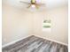 Bedroom with wood-look floors and a window at 2642 Magnolia Cir, Lake Wales, FL 33898