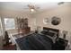 Virtually staged bedroom with a bed, desk, and decorative accents at 2642 Magnolia Cir, Lake Wales, FL 33898