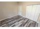 Bedroom with wood-look floors and double closets at 2642 Magnolia Cir, Lake Wales, FL 33898