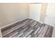Bedroom with wood-look floors and double closets at 2642 Magnolia Cir, Lake Wales, FL 33898