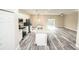 Open concept kitchen with white cabinets, granite countertops, and stainless steel appliances at 2642 Magnolia Cir, Lake Wales, FL 33898