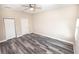 Spacious bedroom with ceiling fan and wood-look flooring at 2642 Magnolia Cir, Lake Wales, FL 33898