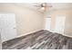 Bright bedroom with ceiling fan and double closets at 2642 Magnolia Cir, Lake Wales, FL 33898