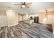 Open living room and kitchen with wood-look floors at 2642 Magnolia Cir, Lake Wales, FL 33898