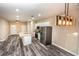 Open kitchen with island, stainless steel appliances, and granite countertops at 2642 Magnolia Cir, Lake Wales, FL 33898