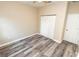 Bright bedroom with wood-look floors and double closets at 2642 Magnolia Cir, Lake Wales, FL 33898