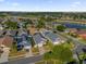 Aerial view of a residential neighborhood with houses and a lake at 2660 Oneida Loop, Kissimmee, FL 34747