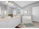 Double vanity bathroom with soaking tub and separate shower at 2660 Oneida Loop, Kissimmee, FL 34747