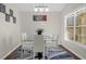 Spacious dining area with large windows and glass table set at 2660 Oneida Loop, Kissimmee, FL 34747
