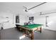 Spacious game room featuring a pool table and air hockey at 2660 Oneida Loop, Kissimmee, FL 34747