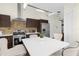 Modern kitchen with stainless steel appliances and white countertop at 2660 Oneida Loop, Kissimmee, FL 34747