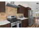 Stainless steel stove and range in modern kitchen at 2660 Oneida Loop, Kissimmee, FL 34747
