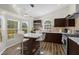 Modern kitchen with stainless steel appliances and an island at 2660 Oneida Loop, Kissimmee, FL 34747