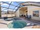 Screened-in pool and jacuzzi with lounge chairs at 2660 Oneida Loop, Kissimmee, FL 34747
