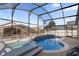 Relaxing screened pool and spa area with ample patio space at 2660 Oneida Loop, Kissimmee, FL 34747