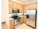 Updated kitchen featuring stainless steel appliances and wood cabinets at 2856 Oakwater Dr # 2856, Kissimmee, FL 34747