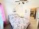 Cozy bedroom with Eiffel Tower bedding and view into kitchen at 2856 Oakwater Dr # 2856, Kissimmee, FL 34747