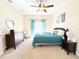 Spacious bedroom with a ceiling fan and ensuite access at 2856 Oakwater Dr # 2856, Kissimmee, FL 34747